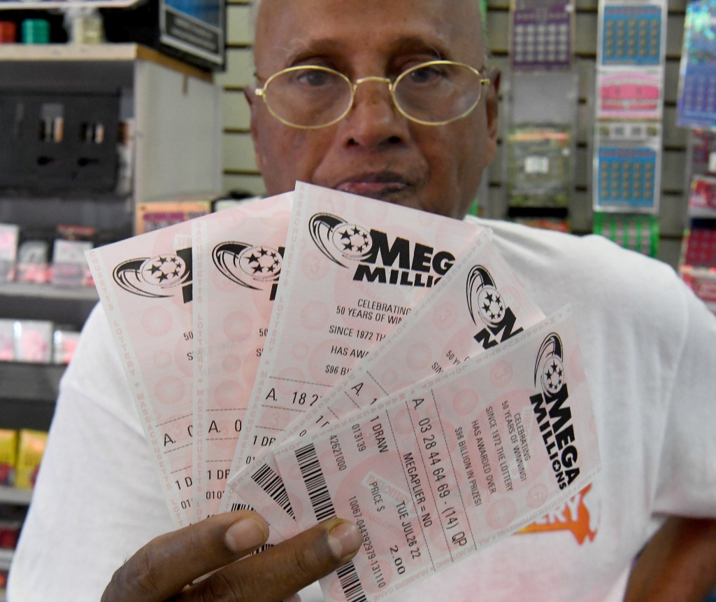 a man holding lottery tickets